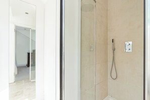 Separate bathtub and shower, hair dryer, towels, soap
