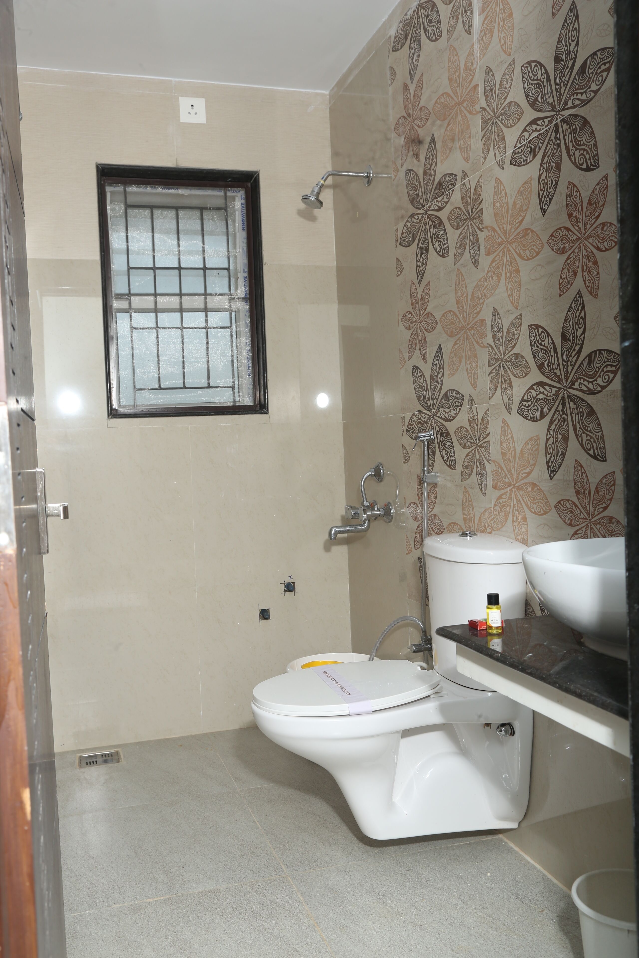 Shower, rainfall showerhead, designer toiletries, hair dryer