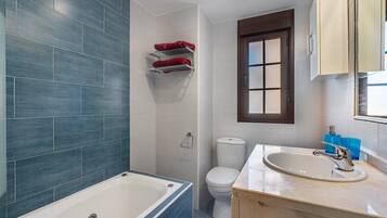 Bathtub, hair dryer, towels