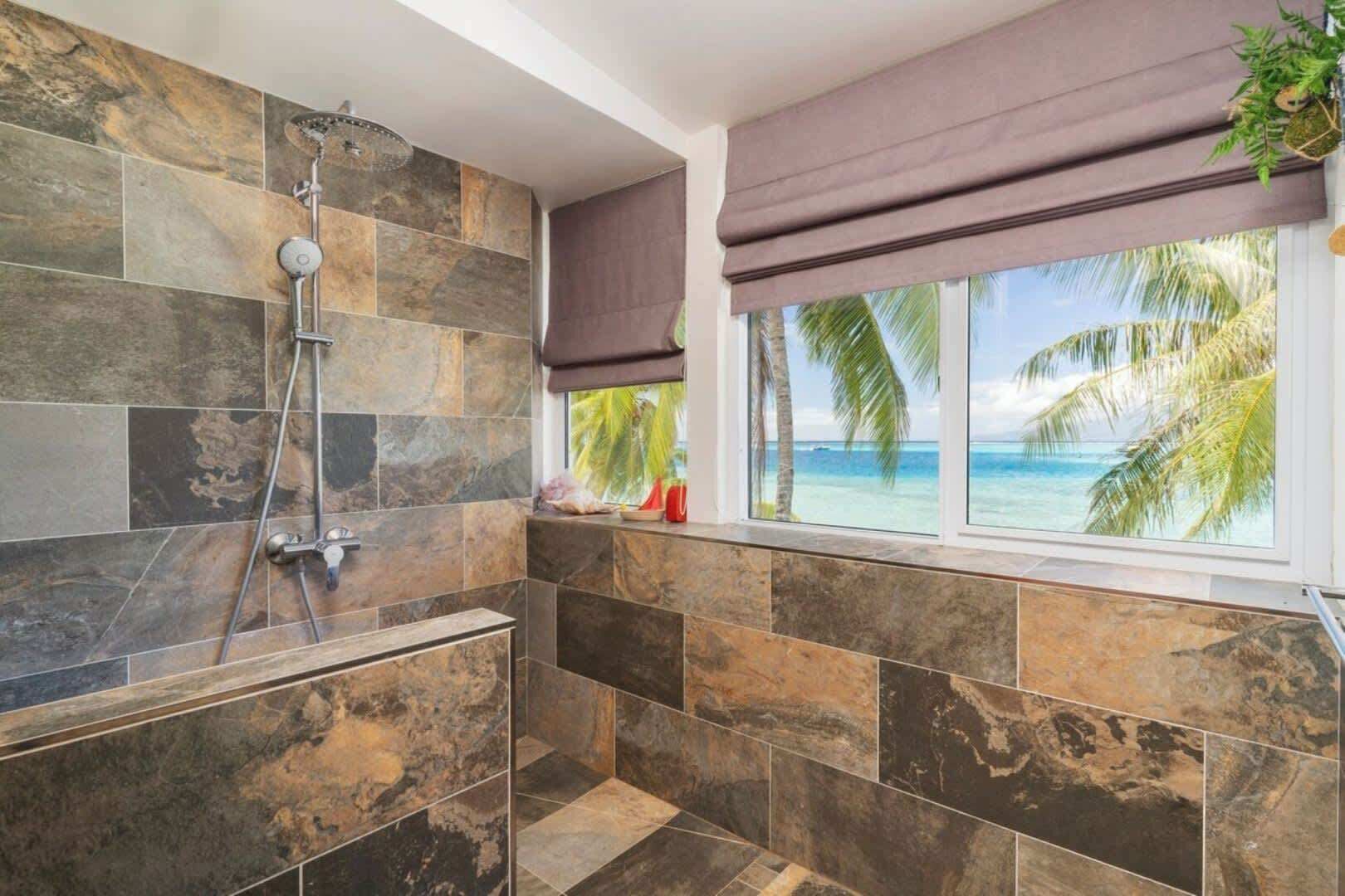 Bathtub, hair dryer, towels, shampoo