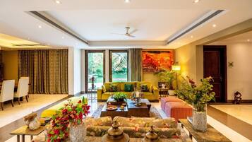Karma Villas- 4 Bedrooms, Private Garden | Living area | 50-inch Smart TV with satellite channels, table football, ping pong