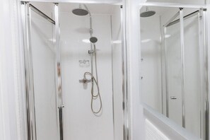 Bathtub, hair dryer, towels