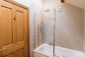 Bathtub, hair dryer, towels