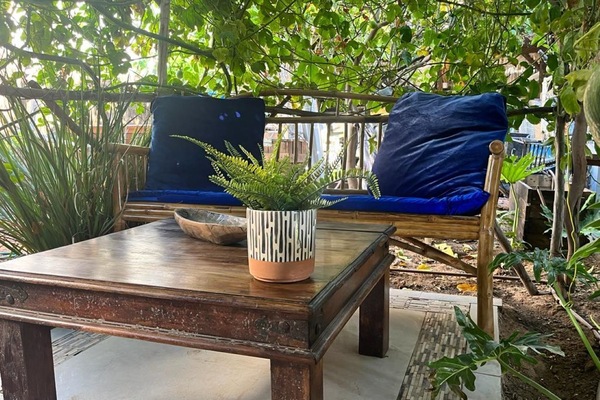 Charming outdoor space with wooden furniture, perfect for morning coffee