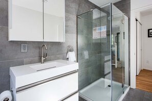 Shower, hair dryer, towels, shampoo