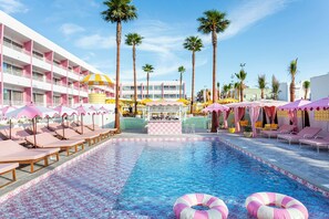 A hotel pool area with sun loungers, umbrellas, and a bar. - Los Felices Ibiza (Sant Josep de sa Talaia)
