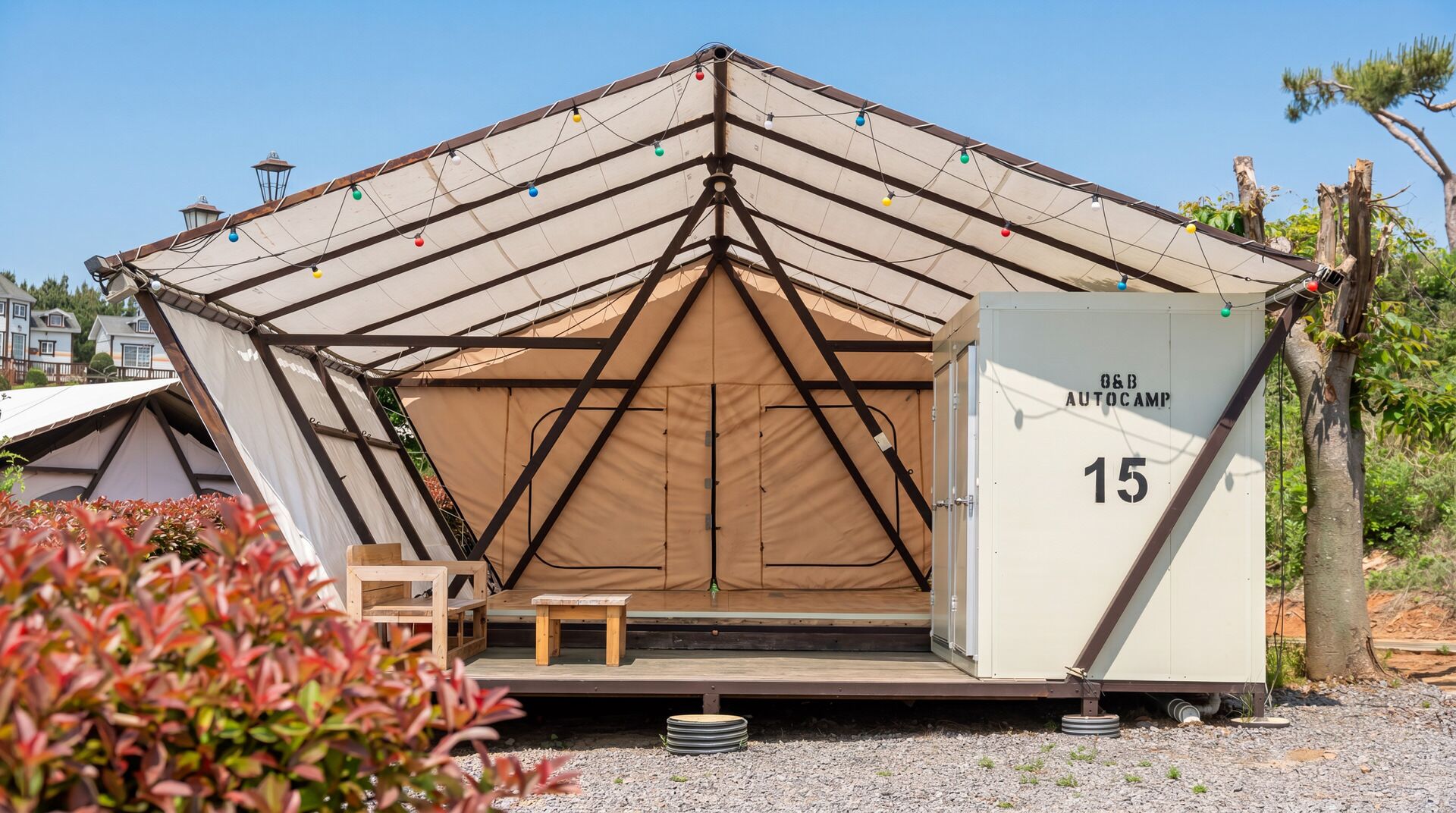 A tented structure with a door labeled 'O&B AUTOCAMIS 15' and a small wooden bench outside.