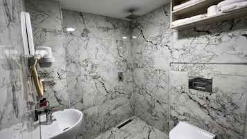 Shower, hair dryer, slippers, towels