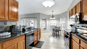 Fridge, microwave, oven, stovetop - Stunning Heated Pool House for 10 in Brandon, FL (Brandon)