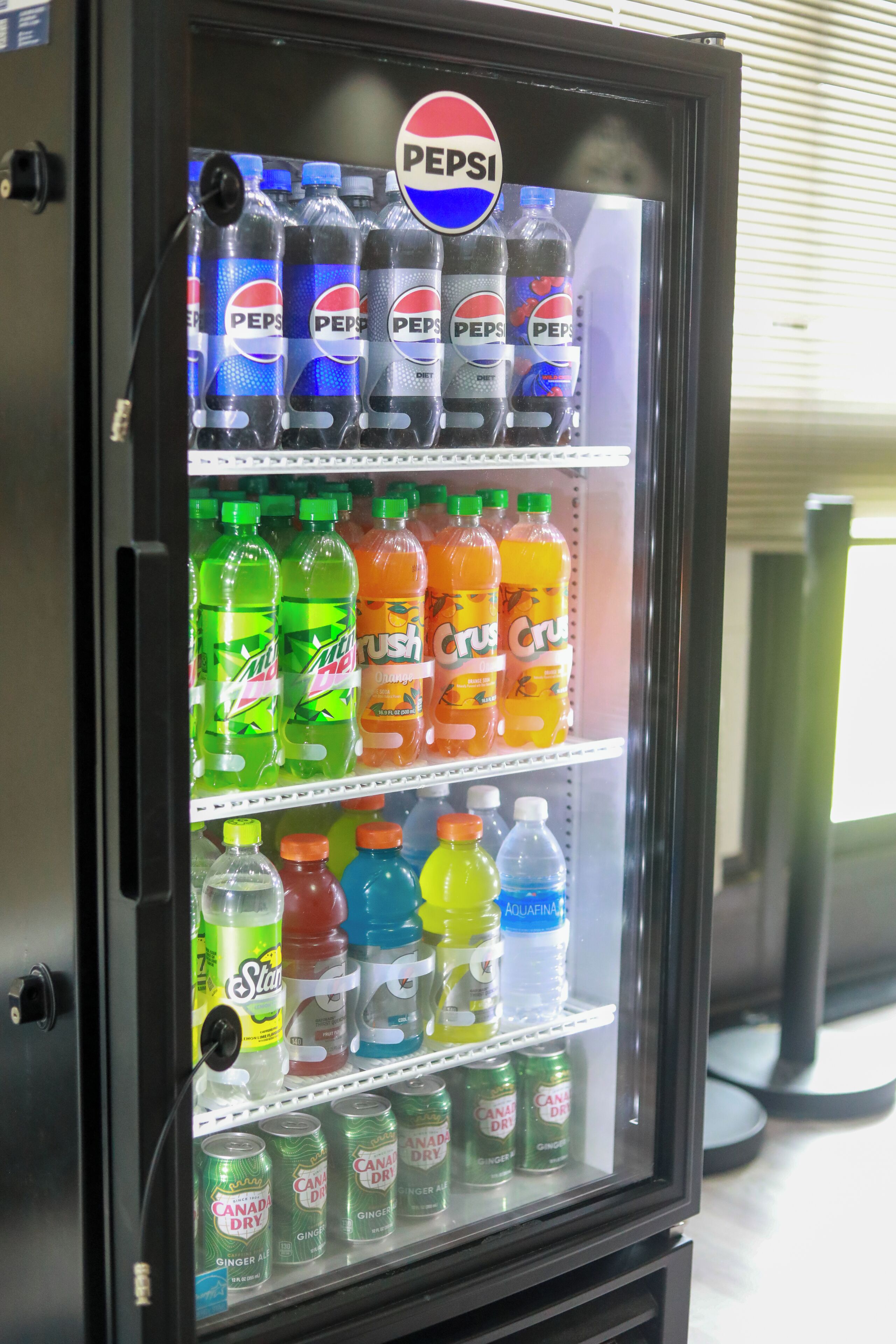 A vending machine with various beverages including Pepsi, Mountain Dew, and other sodas.
