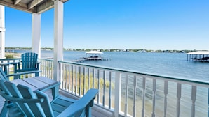 A covered outdoor area with a view of the water, featuring a dock and a gazebo. - Lagoon Front | Pet Friendly | Deeded Beach Access, Pool & Pier (Gulf Shores)