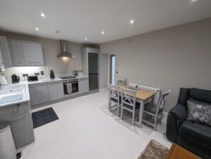 Fridge, microwave, oven, cookware/dishes/utensils