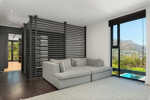 Luxury Villa | Living area | 60-inch flat-screen TV with cable channels, streaming services