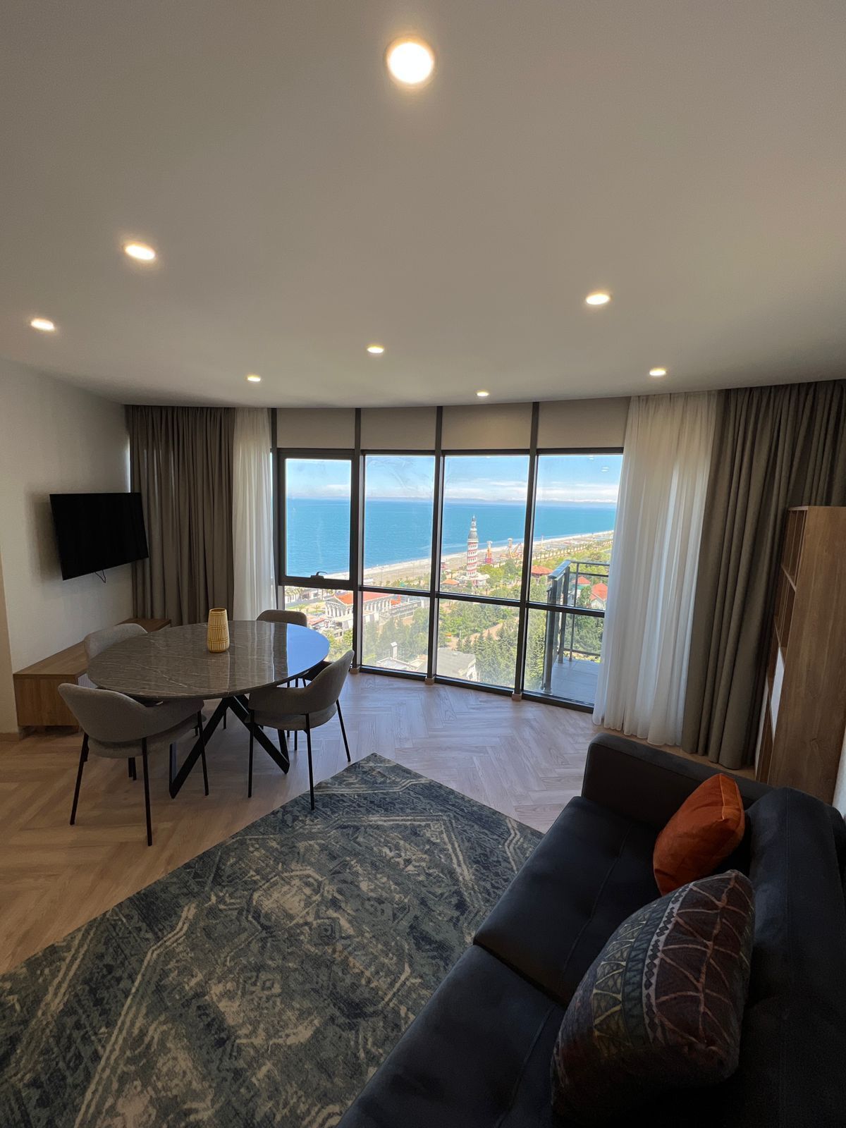 Deluxe Apartment | Living area | 40-inch Smart TV with cable channels