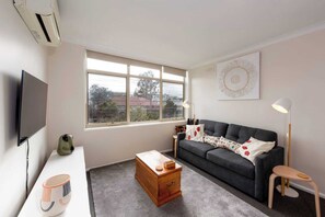 Basic Apartment, 1 Queen Bed | Living area | TV - Bright & Comfortable 1BR Unit in Trendy Brunswick! (Brunswick)