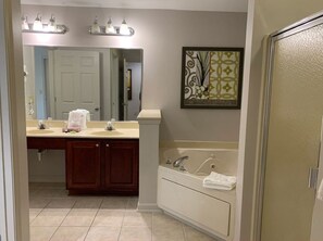 Jetted bath, hair dryer, towels, soap