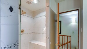 A bathroom with a shower, a toilet, and a sink. - Cozy Washington Retreat w/ Deck, Walk to Beach! (Pacific Beach)