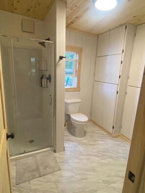 Shower, hair dryer, towels, soap