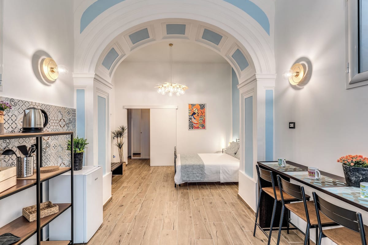 Condo Royal | Área de sala de estar | Televisión de pantalla plana