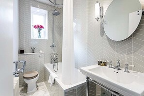 Bathtub, hair dryer, towels