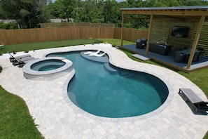 Outdoor pool, a heated pool - 4 BR/4 Ensuite Bath/Games/Walk to Beach & Heated Pool / Spa (Gulfport)