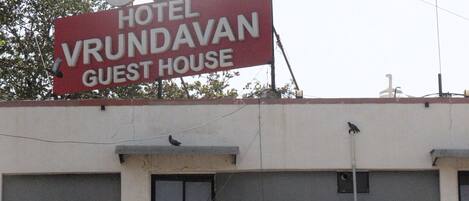 A building with a prominent sign for 'OYO Hotel Vrundavan Guest House'.