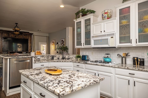 AMAZING Pool home with outdoor kitchen, firepit, and waterfall Close 2 Casinos! 