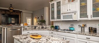 AMAZING Pool home with outdoor kitchen, firepit, and waterfall Close 2 Casinos! 