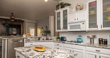 AMAZING Pool home with outdoor kitchen, firepit, and waterfall Close 2 Casinos!