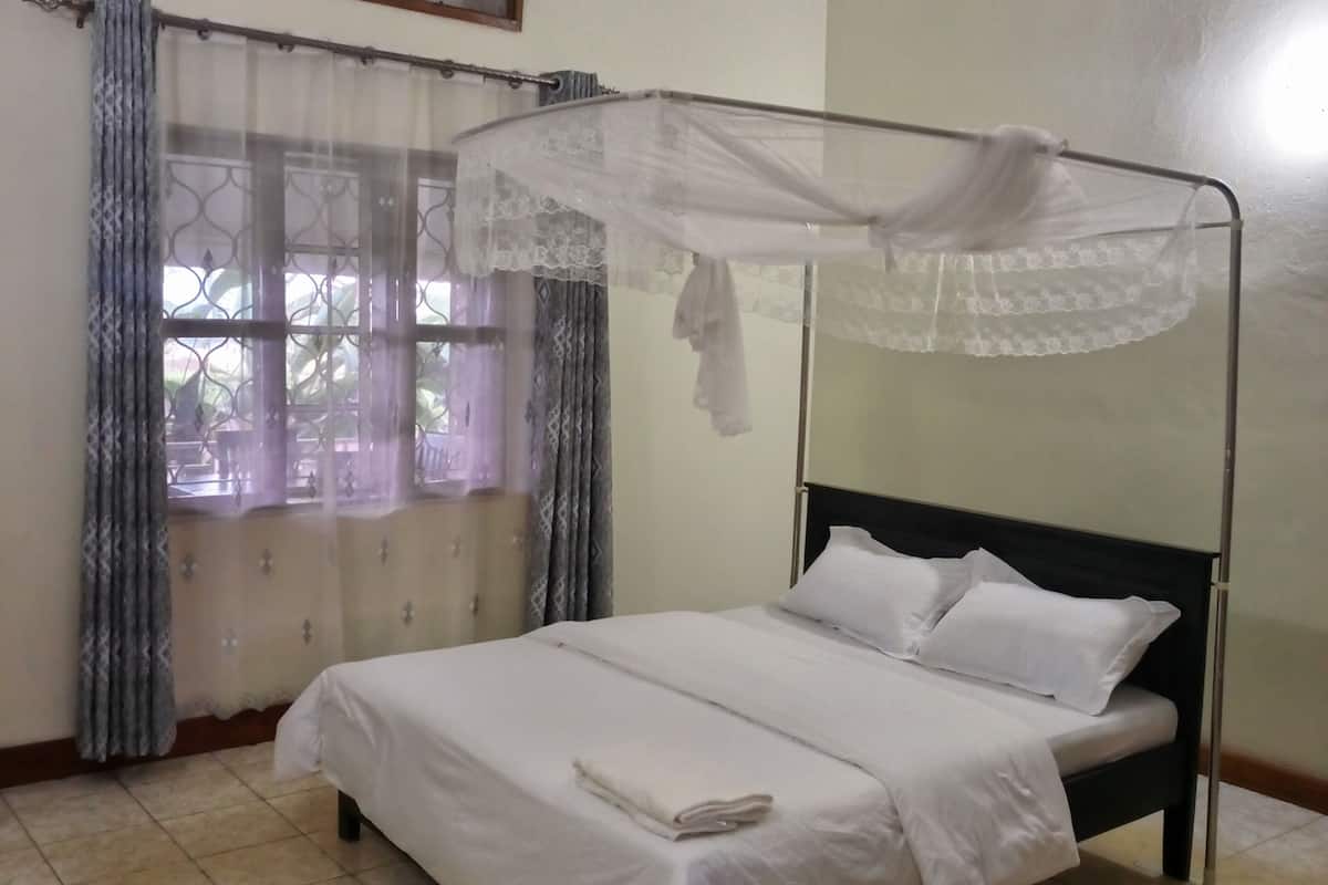 Desk, laptop workspace, bed sheets