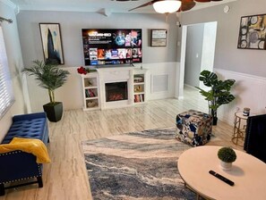 Smart TV, fireplace, table tennis, books