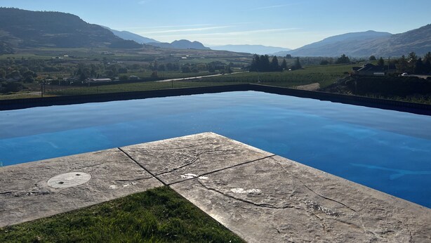 A swimming pool with a view of a valley and mountains. - Oliver Oasis, Merlot - Vineyard home with great pool, hot tub & views for days!  (Osoyoos)