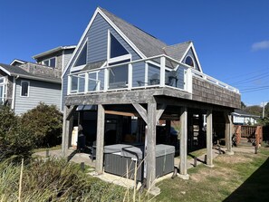 A two-story house with a balcony and a hot tub in the backyard. - Spindrift - Right on the Beach-New Hot Tub (Moclips)