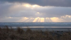 A beach with a view of the ocean and a cloudy sky. - Sea Angel - Stunning views from this ocean front home ! (Moclips)