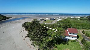 An aerial view of a beachside RV park with a house and trees in the foreground. - Joe Creek Inn- Unique Home (Pacific Beach)
