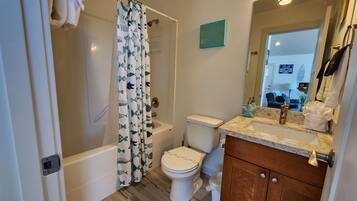 Bathtub, hair dryer, towels