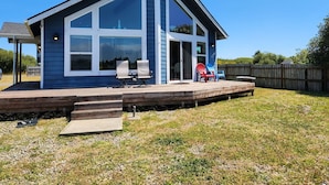 A modern two-story house with a large deck, large windows, and a covered patio area. - The Lake House - Best of both worlds (Ocean Shores)