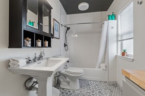 Bathtub, hair dryer, towels