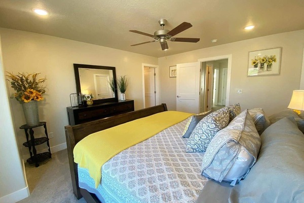 In addition to a comfy bed, this room offers a dresser, ceiling fan, a spacious walk-in closet, and a portable crib for your little one.