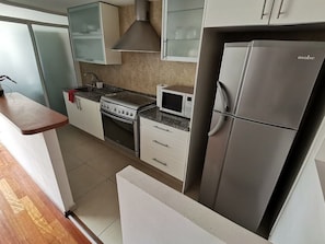 Apartment | Private kitchen | Full-sized fridge, microwave, oven, toaster