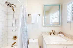 Hair dryer, towels, shampoo, toilet paper