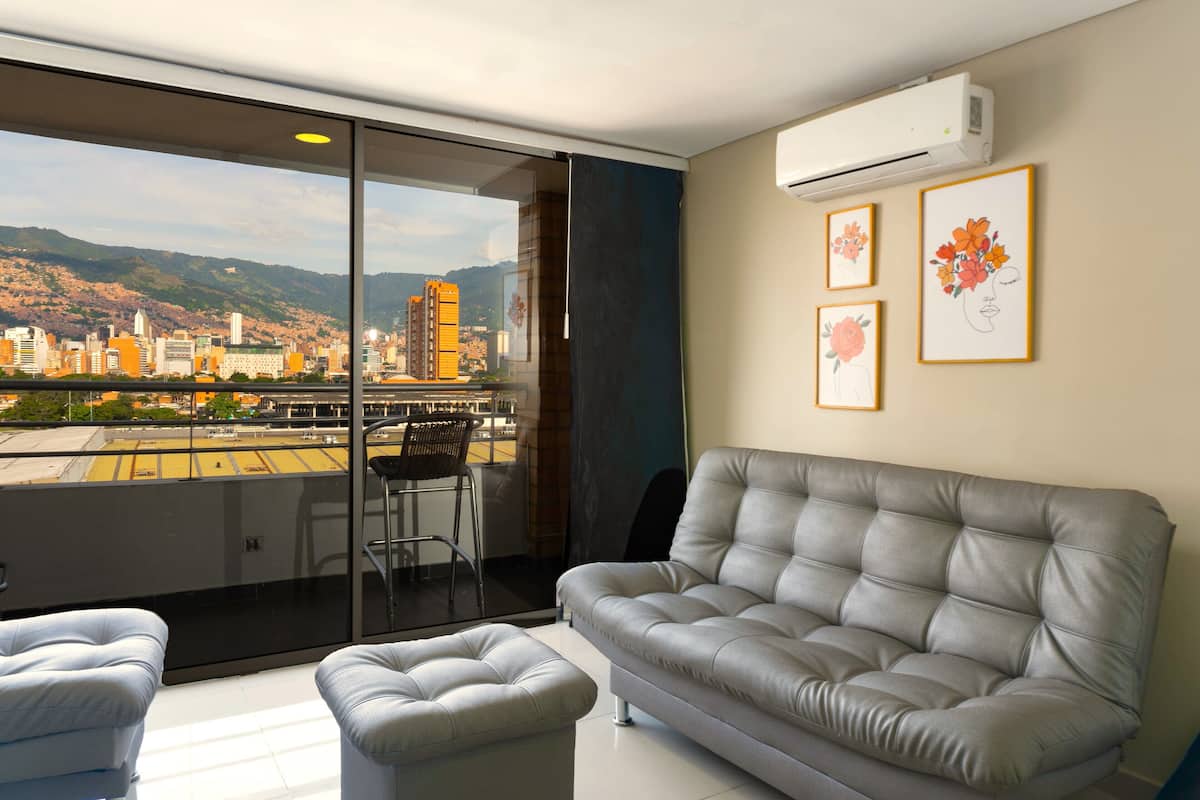 Standard Apartment | Living area | 43-inch Smart TV with cable channels
