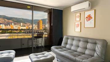 Standard Apartment | Living area | 43-inch Smart TV with cable channels