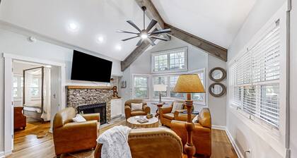 Dog-friendly home with private deck, outdoor fireplace, & immaculate interior