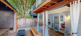Modern lower-level getaway with a fireplace, inviting patio & washer/dryer