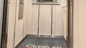 An elevator with a floor indicator reading "Class 48". - Spacious loft at amazing location! (sabaneta)