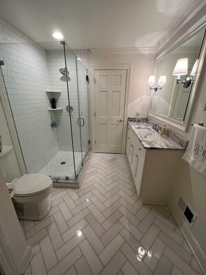 Shower, towels, soap, toilet paper