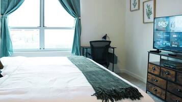1 bedroom, desk, iron/ironing board, travel crib