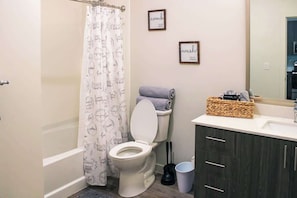 Shower, hair dryer, towels, shampoo
