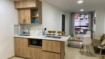 Fridge, microwave, stovetop, coffee/tea maker